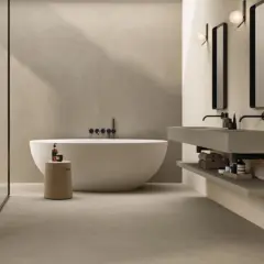 Bagno moderno con vasca freestanding, doccia a vista e doppio lavabo sospeso. La posa del rivestimento bagno crea un'atmosfera rilassante.