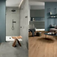 Bagno moderno con pavimento in resina e doccia con piastrelle verticali, affiancato da un soggiorno con pavimento in legno e pareti blu.