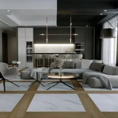 Soggiorno moderno con pavimenti interni che combinano marmo e legno, tra le ultime tendenze. Divano grigio, poltrona, tavolini e cucina a vista.