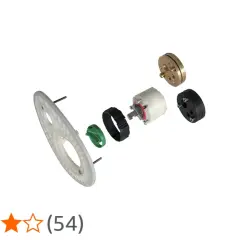 Parti di ricambio per rubinetteria Ideal Standard vecchi modelli: un disco bianco, un anello verde, un meccanismo bianco e nero, e un componente dorato.
