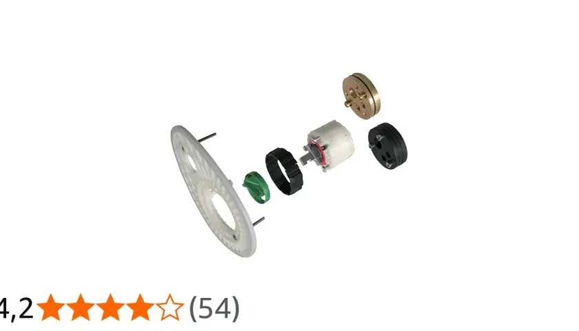 Parti di ricambio per rubinetteria Ideal Standard vecchi modelli: un disco bianco, un anello verde, un meccanismo bianco e nero, e un componente dorato.