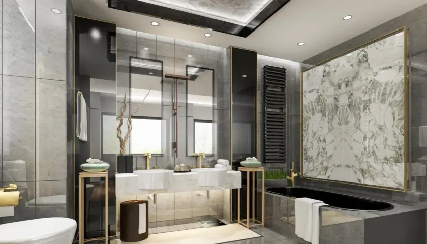 Bagno elegante e raffinato con vasca nera, doppio lavabo, specchi e finiture dorate.
