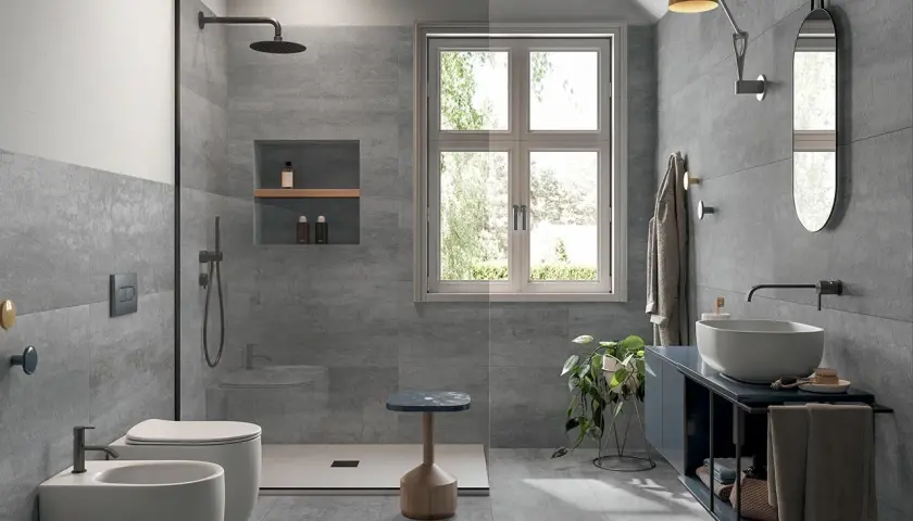 Bagno moderno con doccia walk-in, WC, bidet e lavabo. Si posa prima il pavimento o il rivestimento, creando un ambiente elegante e funzionale.
