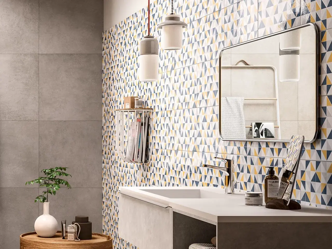 Un bagno moderno con piastrelle geometriche colorate che coprono le pareti. Un lavandino minimalista e un grande specchio completano l'arredo.