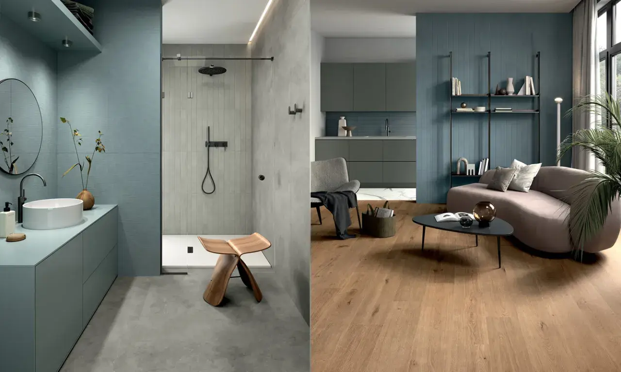 Bagno moderno con pavimento in resina e doccia con piastrelle verticali, affiancato da un soggiorno con pavimento in legno e pareti blu.