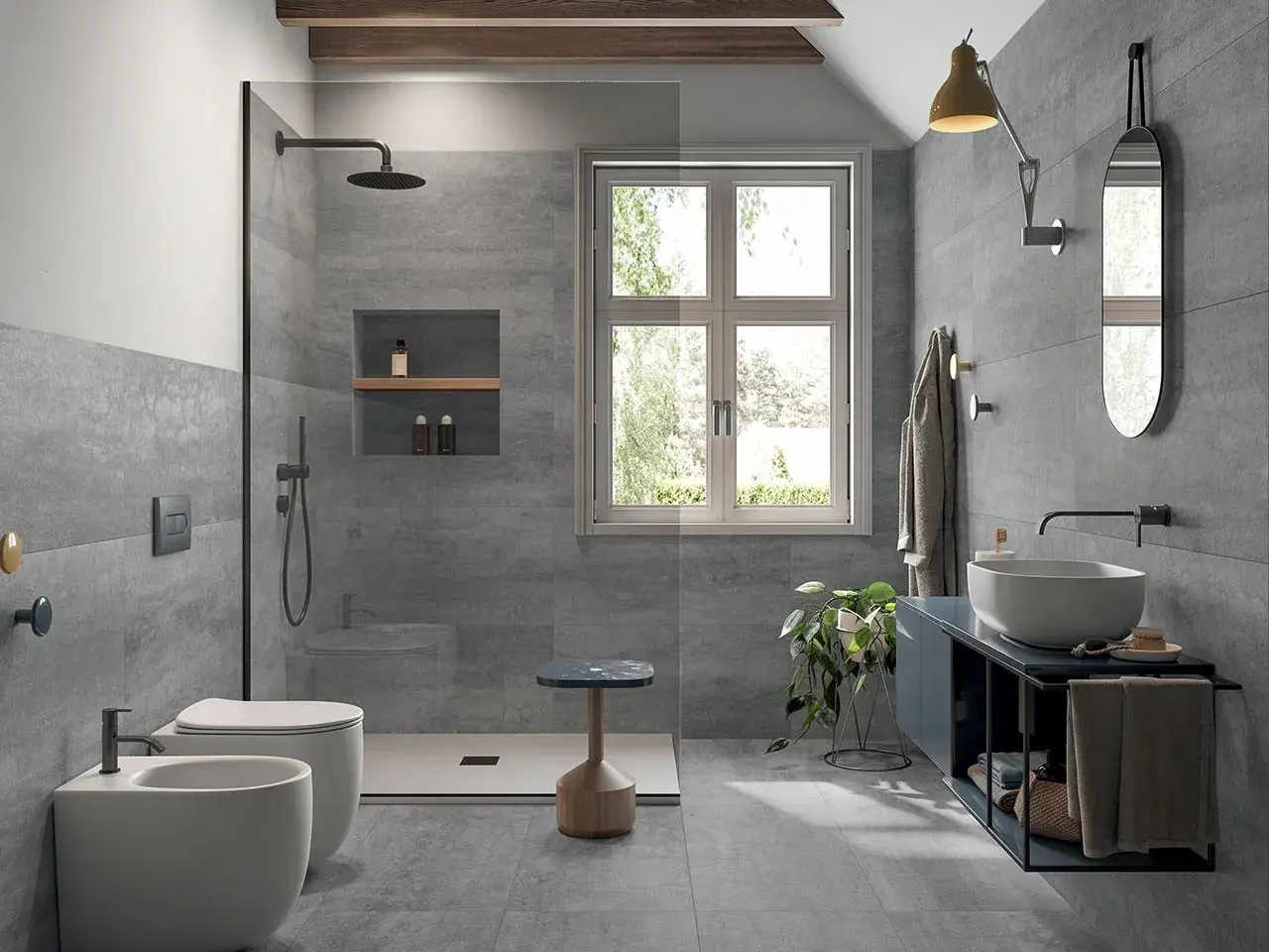 Bagno moderno con doccia walk-in, WC, bidet e lavabo. Si posa prima il pavimento o il rivestimento, creando un ambiente elegante e funzionale.