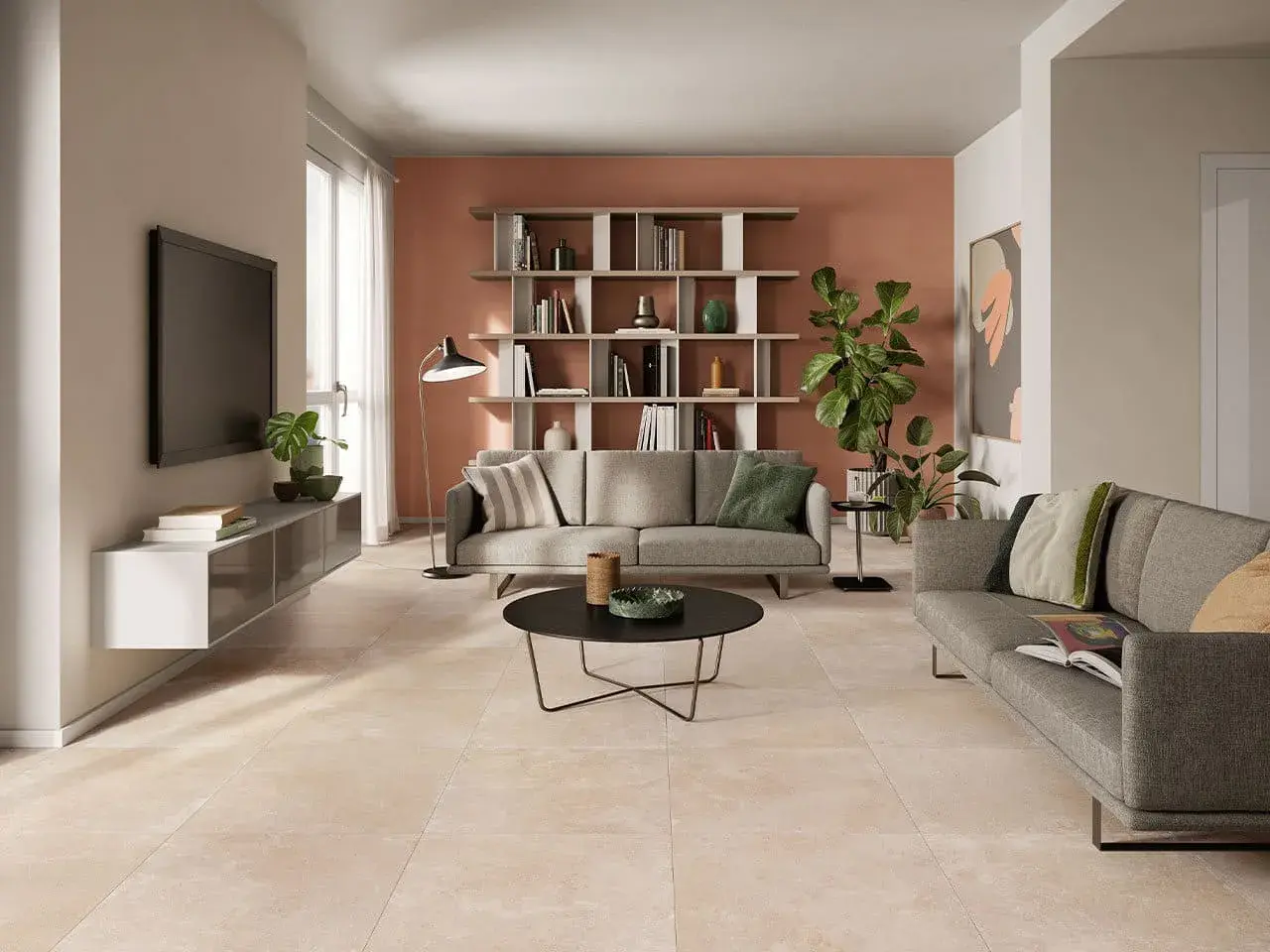 Soggiorno moderno con divani grigi, libreria e un elegante pavimento effetto cemento abbinamento perfetto con l'arredo.