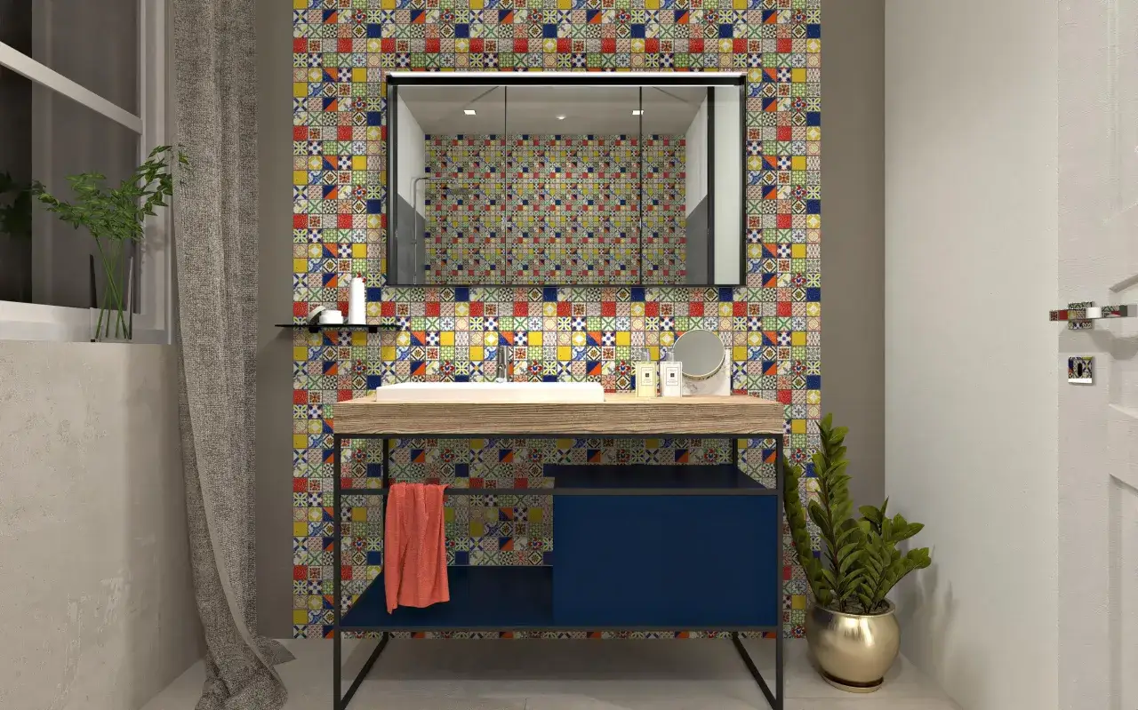Un bagno moderno con un lavabo su un mobile blu scuro, incorniciato da un vivace boxer mosaico che riveste la parete.